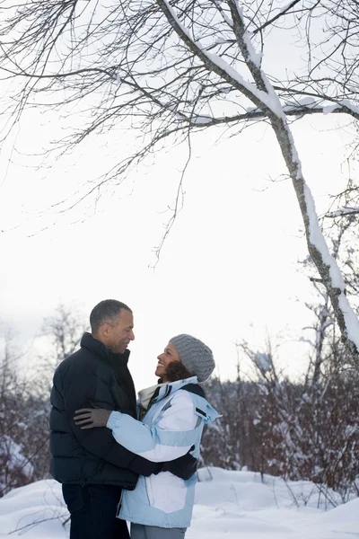 Couple embracing while walking in nature — Stock Photo, Image