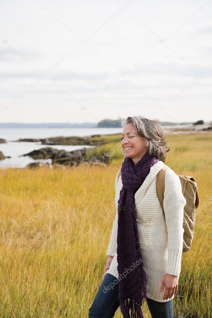 Mature woman walking on marshland