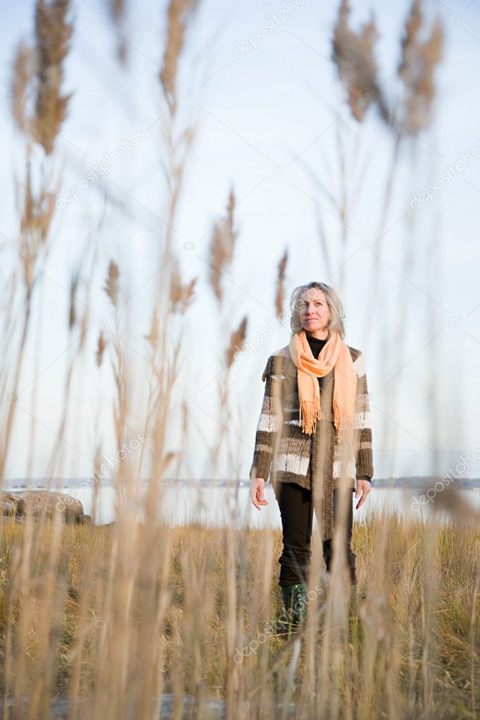 Woman standing on marshland