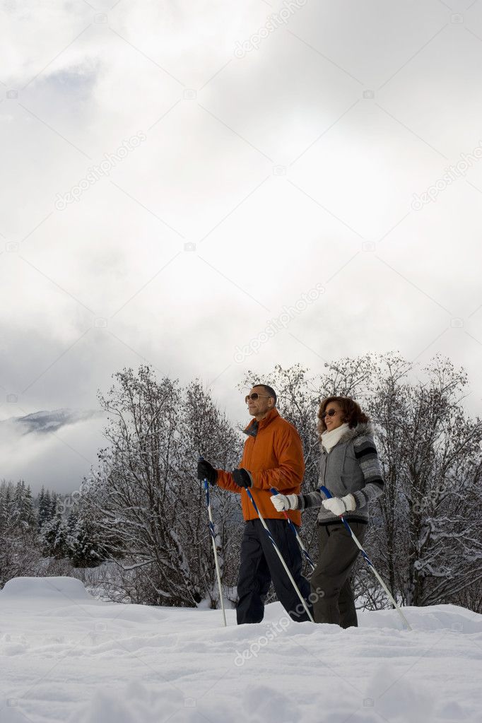 mature couple skiing