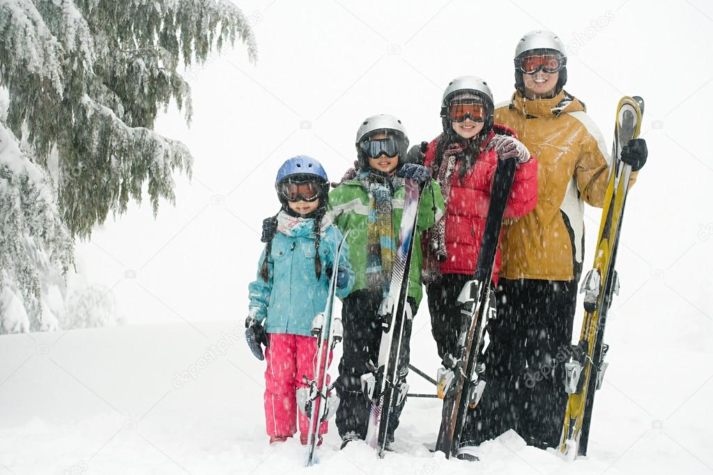 Family in the snow forest