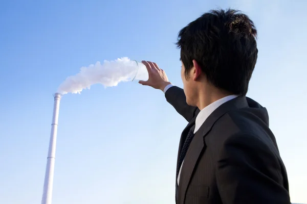 Businessman Collecting Smoke in Beaker — Stock Photo, Image