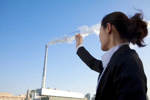 Businesswoman Collecting Smoke in Beaker — Stock Photo, Image