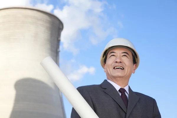 Businessman at power plant — Stock Photo, Image