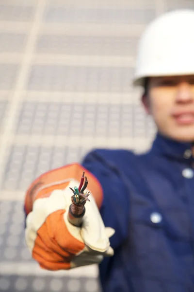 Manual worker with frayed wire — Stock Photo, Image