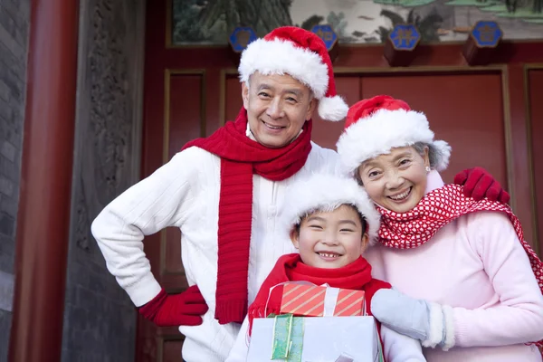 Family holding Christmas Gifts — Stock Photo, Image