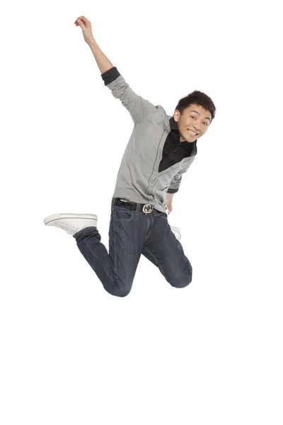 Portrait of an excited young man mid-air — Stock Photo, Image