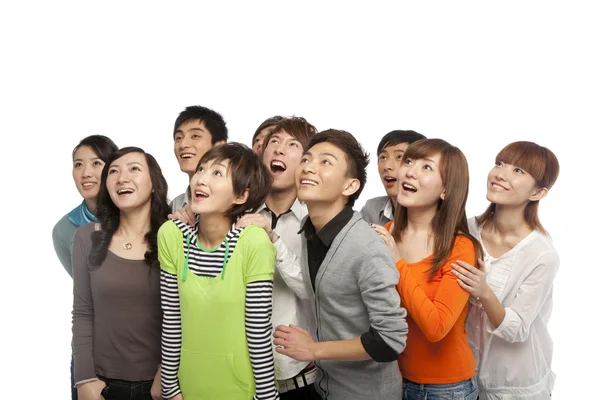Um grupo de pessoas olhando para cima em emoção — Fotografia de Stock