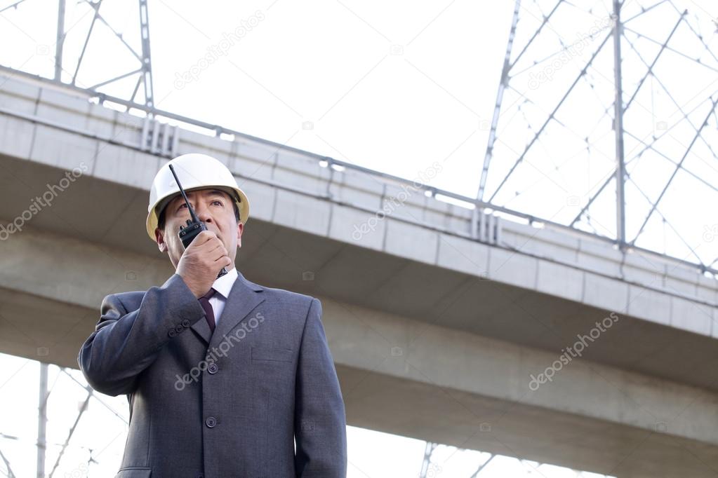 Businessman on Walkie Talkie