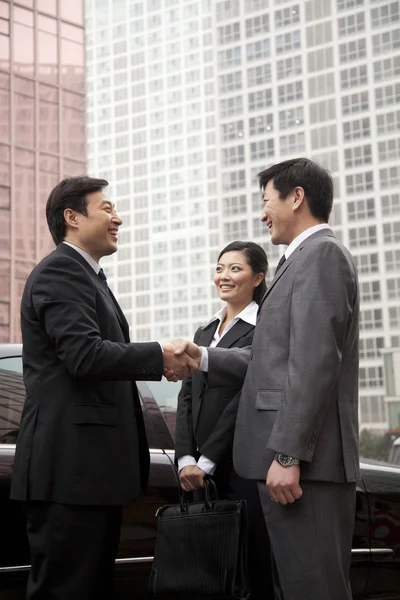 Three business people outdoors — Stock Photo, Image