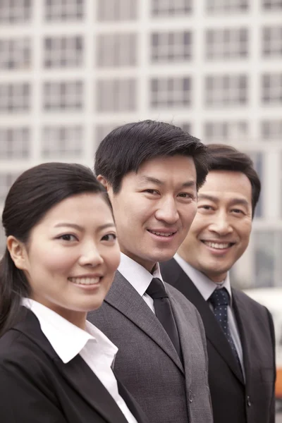 Three business people outdoors — Stock Photo, Image