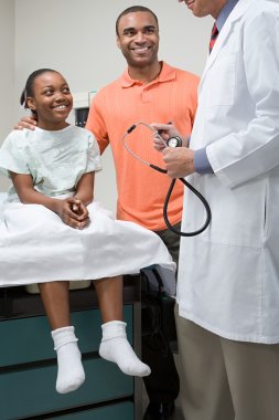 Girl with father and doctor clipart