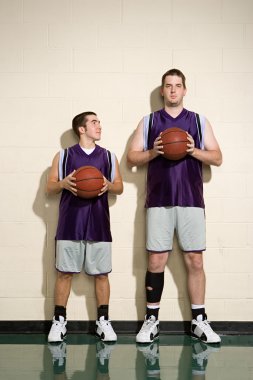 Tall and short basketball players clipart