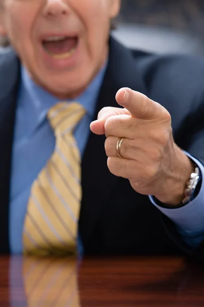 Businessman pointing in office — Stock Photo, Image