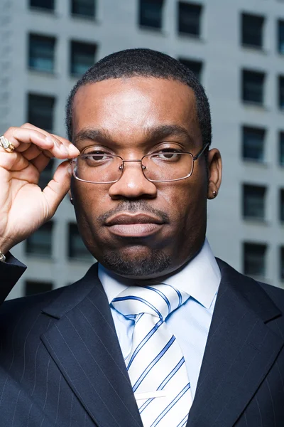 Serious businessman wearing eyeglasses — Stock Photo, Image