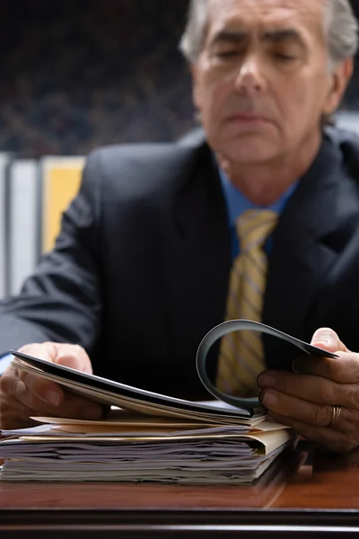 Businessman looking at file — Stock Photo, Image