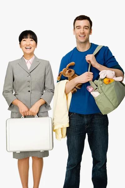 Businesswoman and husband smiling — Stock Photo, Image