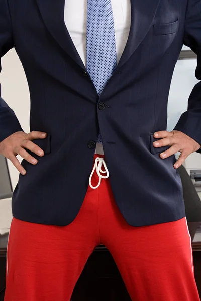 Businessman wearing tracksuit bottoms — Stock Photo, Image