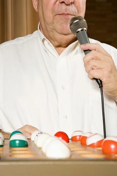 Bingo caller at work — Stock Photo, Image