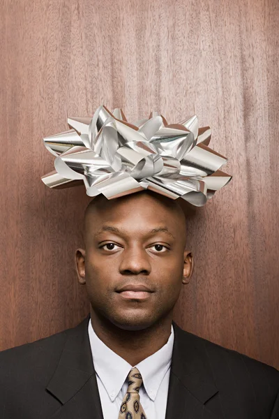 Businessman with bow on his head — Stock Photo, Image