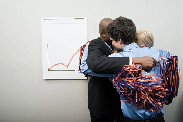 Four office workers embracing — Stock Photo, Image