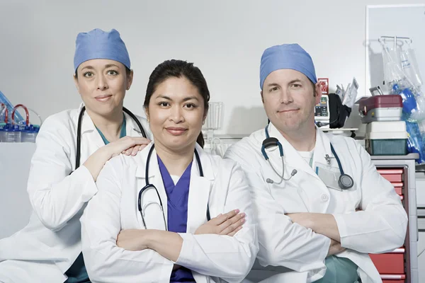 Three doctors in medicine office — Stock Photo, Image