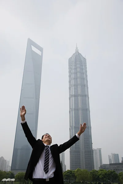 Joyous businessman with his arms raised — Stock Photo, Image