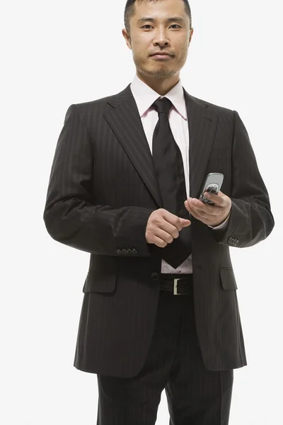 Retrato de um homem de negócios usando um telefone — Fotografia de Stock
