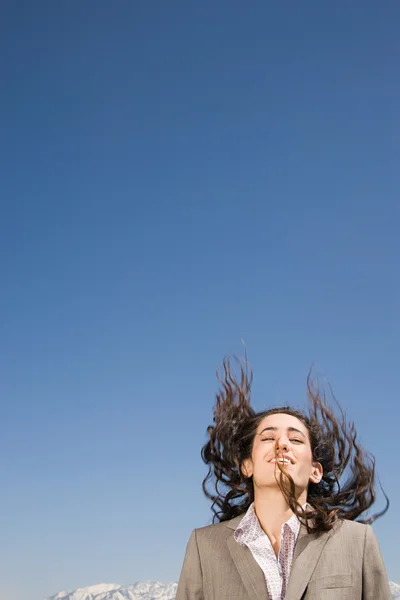 Woman jumping in air by mountains — Stock Photo, Image