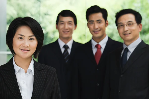 Four chinese businesspeople — Stock Photo, Image