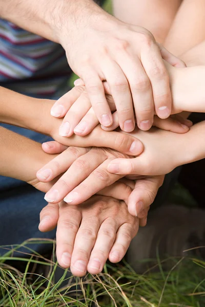 Family putting their hands together — Stock Photo, Image