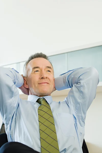 Businessman with hands behind his head — Stock Photo, Image