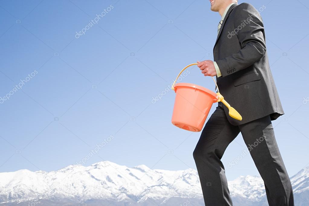 depositphotos_93997172-stock-photo-man-with-bucket-and-spade.jpg