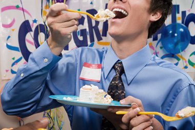 Businessman eating party cake clipart