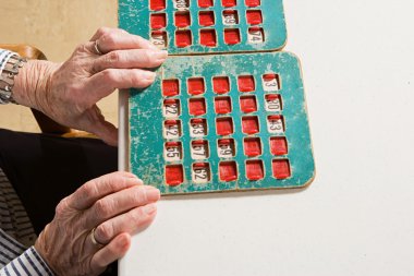 Senior woman playing bingo clipart