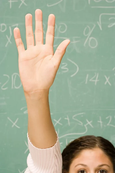 Female student with her hand raised — Stock Photo, Image