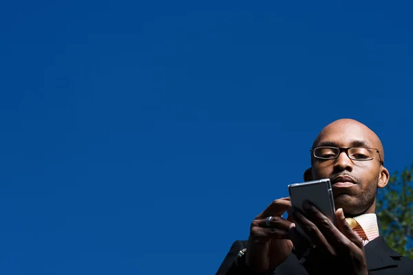 Businessman using handheld computer — Stock Photo, Image