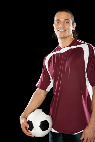 Footballer with ball smiling — Stock Photo, Image