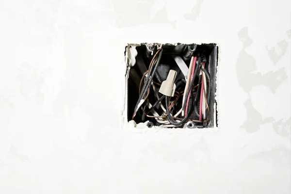 Wires in a hole of wall home — Stock Photo, Image