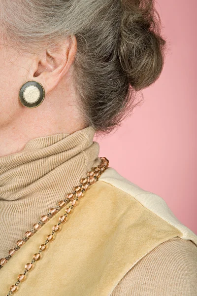 Senior woman wearing jewelery — Stock Photo, Image