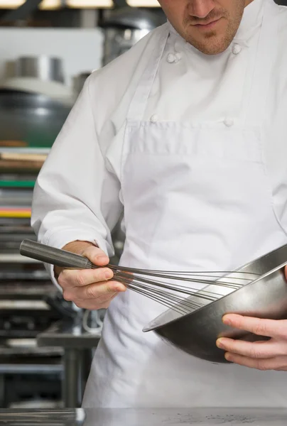 Chef whisking on kitchen — Stock Photo, Image