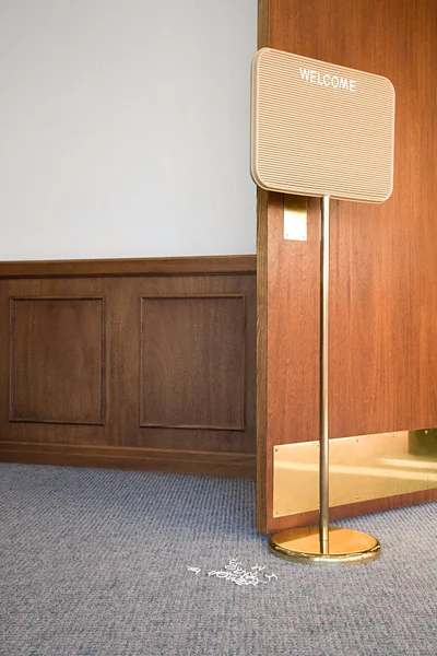 Welcome sign in empty office — Stock Photo, Image