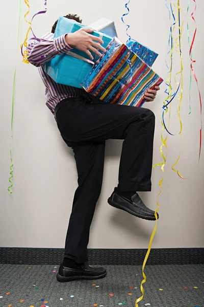 Businessman carrying presents — Stock Photo, Image