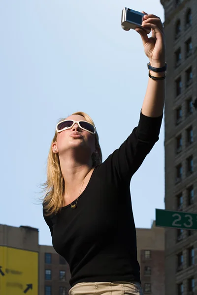 Woman taking a picture of herself — Stock Photo, Image