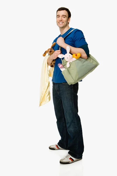 Man with baby supplies — Stock Photo, Image