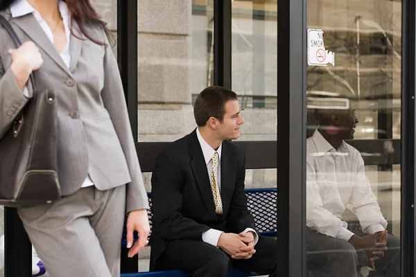 People waiting at bus stop — Stock Photo, Image