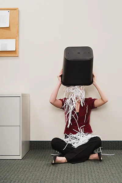 Woman tipping shredded paper over herself — Stock Photo, Image