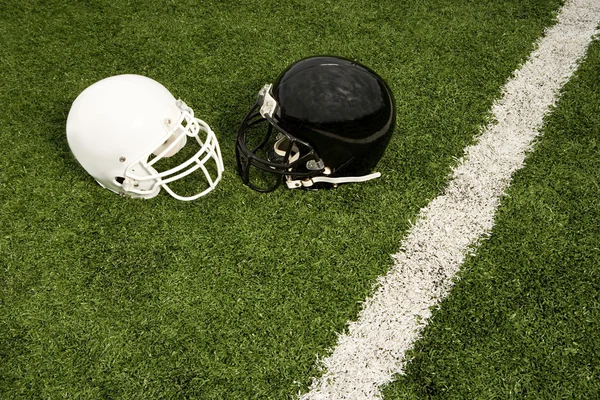 Black and white football helmets — Stock Photo, Image