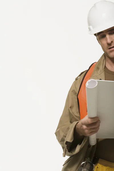 Construction worker with plan — Stock Photo, Image