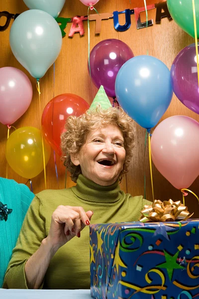 Senior woman at a party — Stock Photo, Image